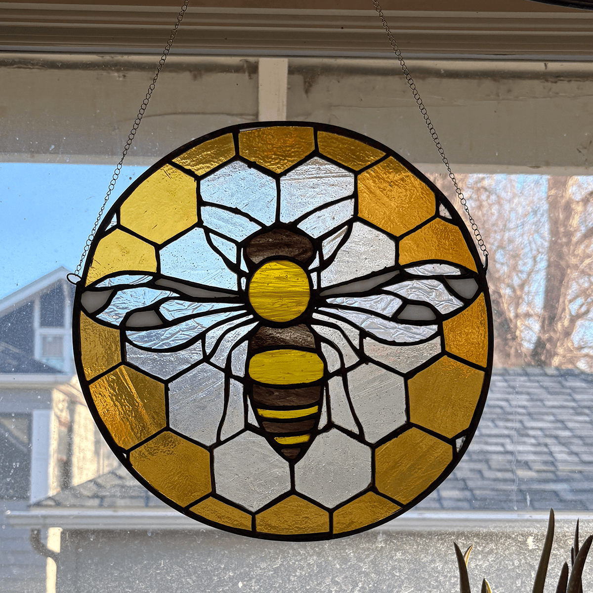 Round bee stained glass Pane in the Glass Wyo